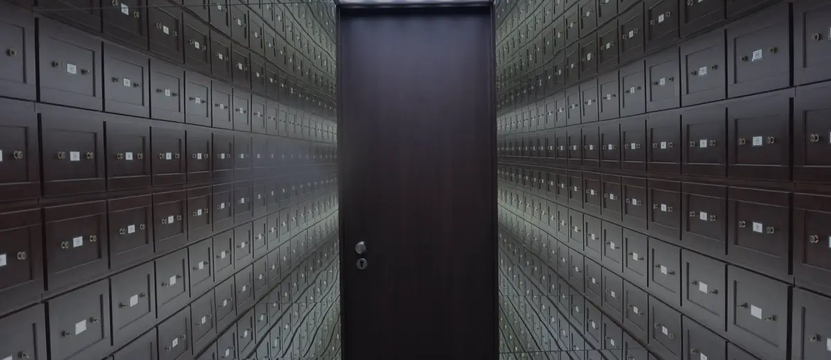 A long corridor lined with safe deposit boxes.