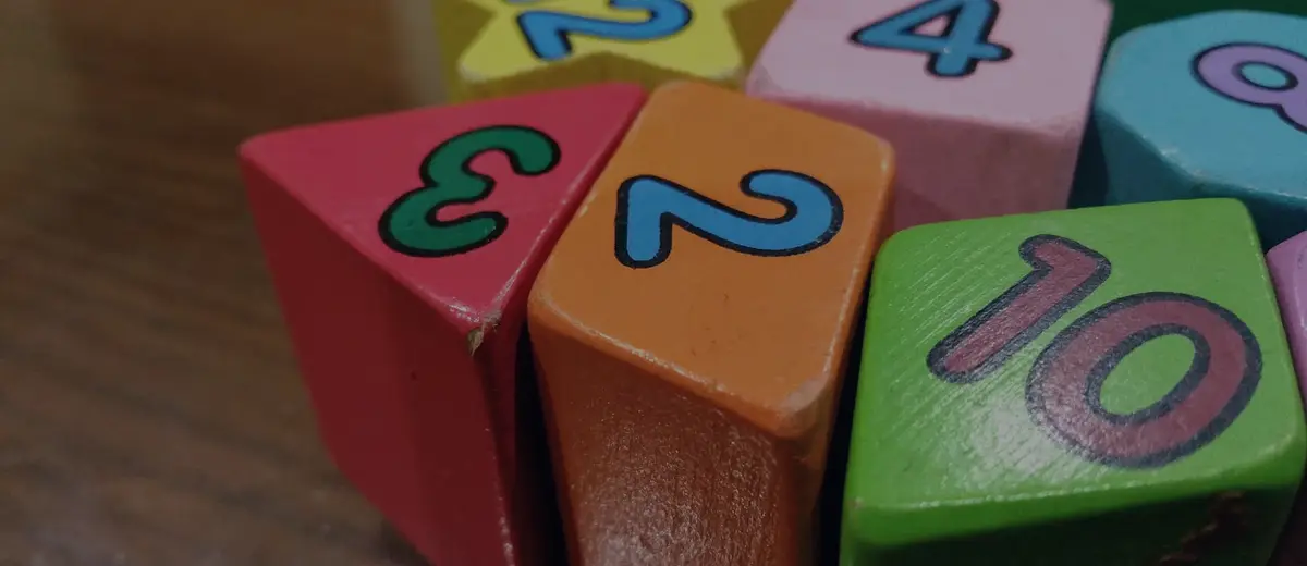 Colorful wooden toy blocks on a table.
