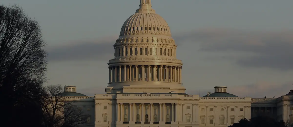 The U.S. Capitol dome lit by the setting sun.