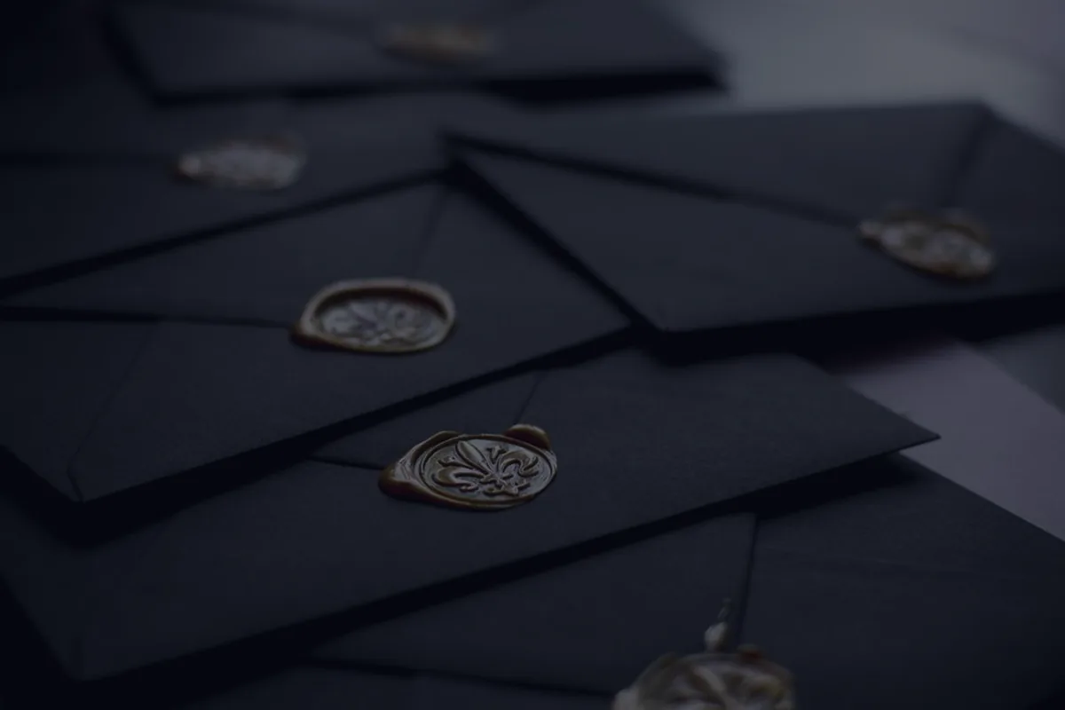 Dark wax-sealed envelopes, representing estate planning documents.