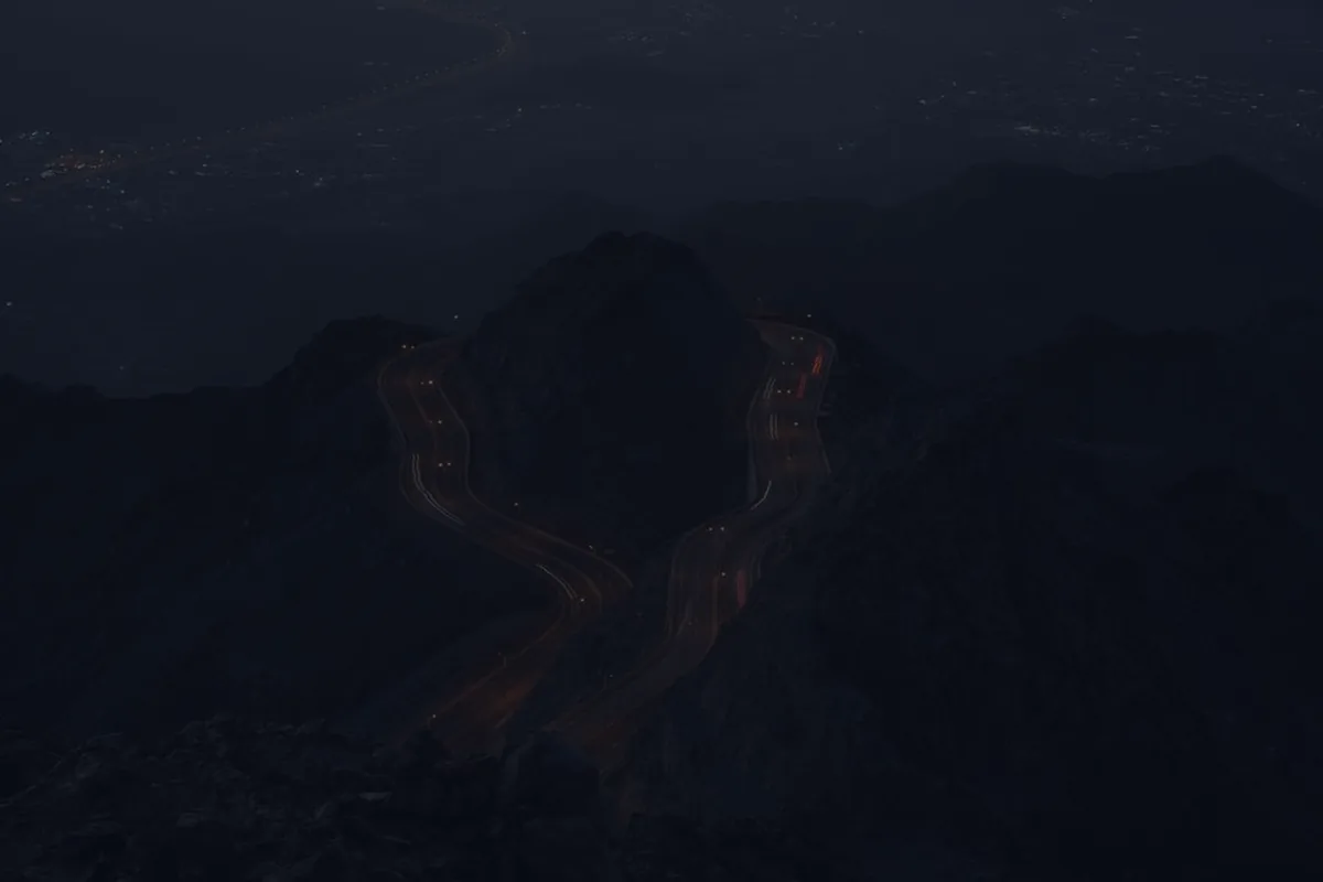 A dark mountain ridge at dusk, representing the path to financial independence and early retirement.
