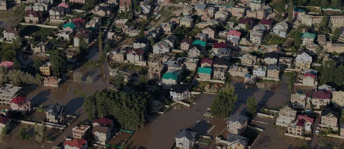 An aerial view of a residential neighborhood covered by floodwater.