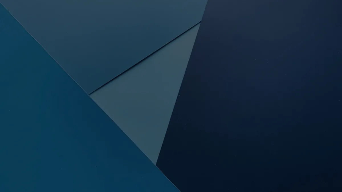 Clean blue geometric paper forms on dark, representing bonds as a structured investment.