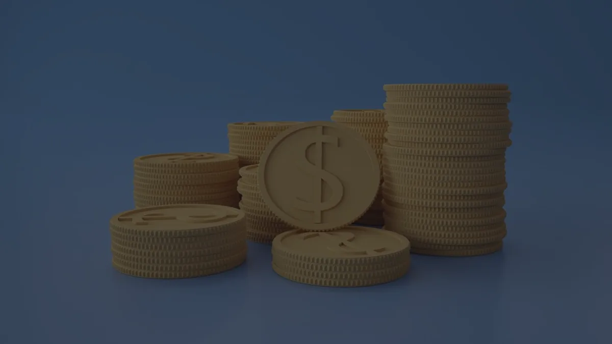 Stacks of gold coins on a dark blue background, representing maxing out 401(k) contributions.