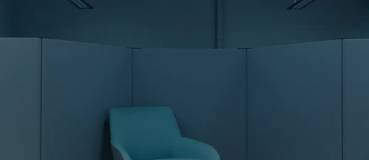 A single blue chair in an empty office.
