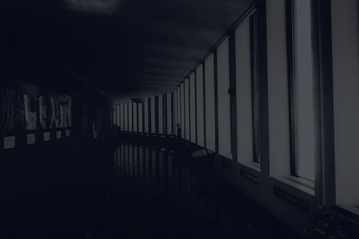 A dark hospital corridor, representing medical debt.