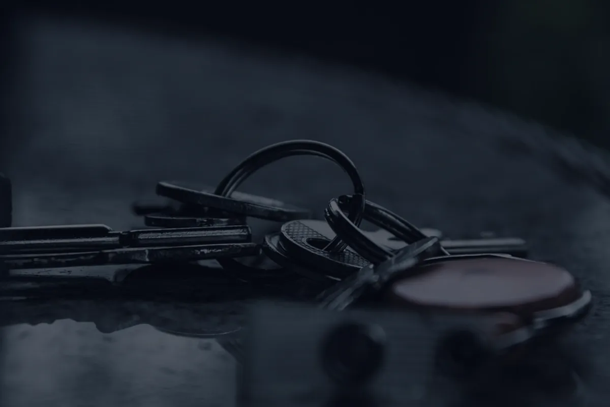 Keys in dark moody light, representing renters insurance.