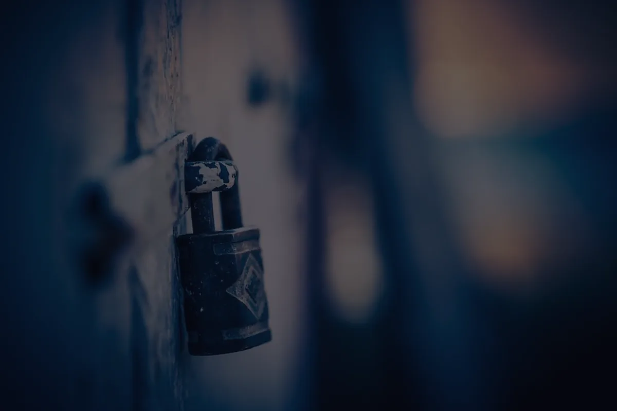 A padlock in dark metal tones, representing secured versus unsecured debt.
