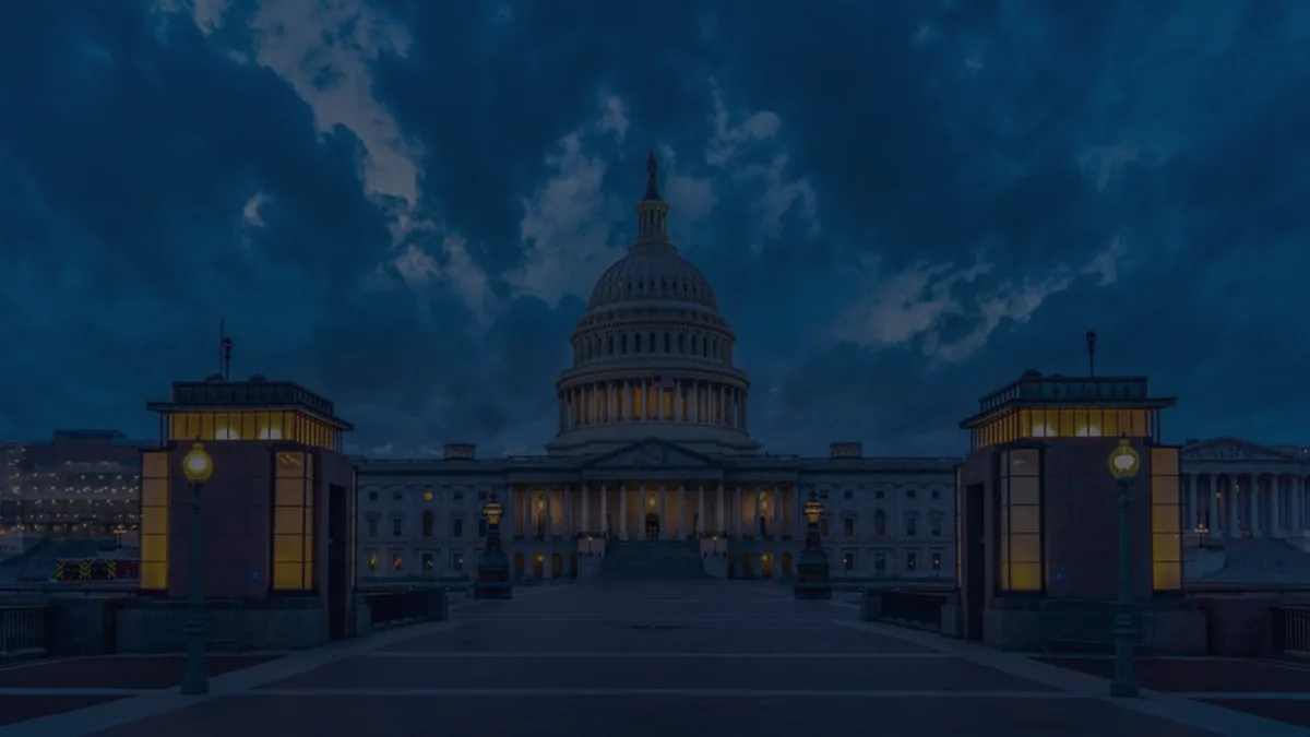 The U.S. Capitol lit at dusk, representing Social Security and federal retirement benefits.