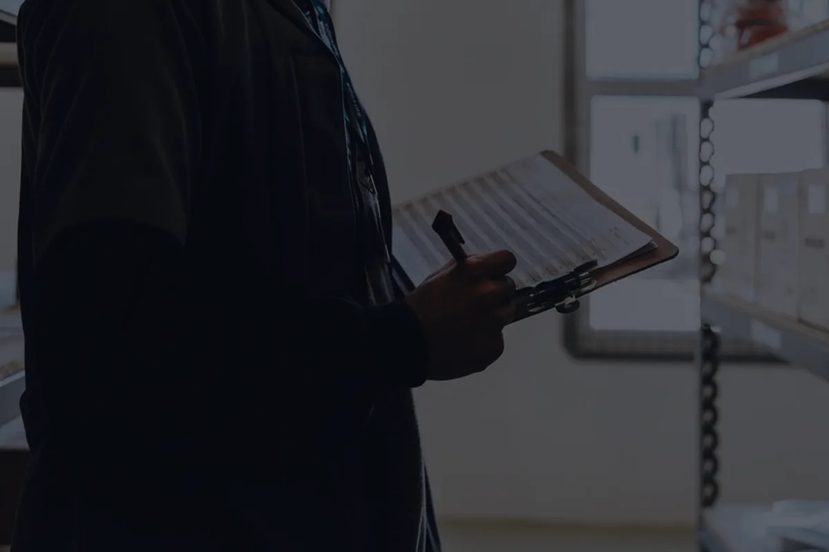 A dark clipboard in moody light, representing auditing your subscriptions.
