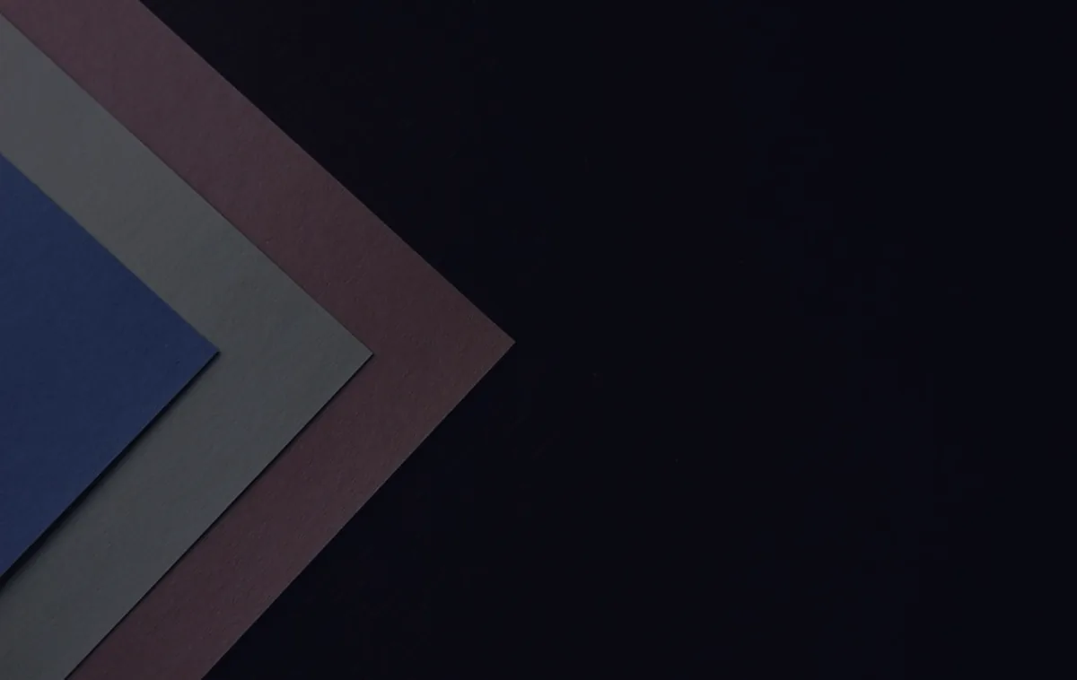 A clean abstract chevron on dark, representing zero-based budgeting.
